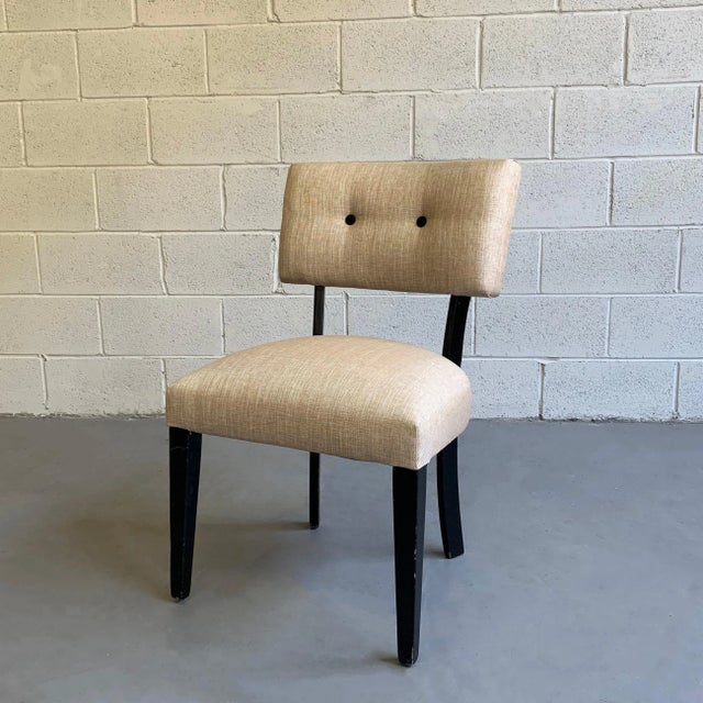 Mid-Century Modern, slipper side chair features a black lacquered maple frame with woven, cotton linen upholstery and...