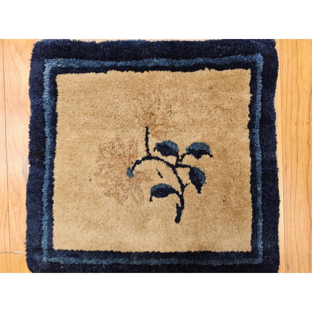 A beautiful hand-knotted small Chinese Art Deco rug from the first quarter of the 20th century, woven in an unusually...