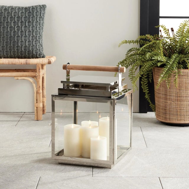 With a teak handle, wide glass panes and tailored square profile, this outdoor lantern is a handsome look for patio, porch...
