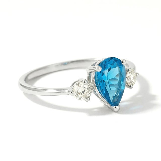 Pear Blue Topaz & Diamond Accent Ring in Gold Cool, luminous, and effortlessly refined, this ring features a captivating...