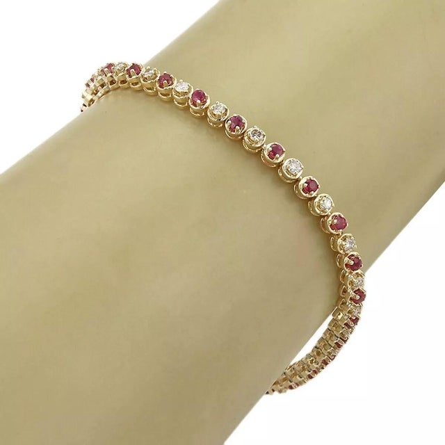 Material: 14k yellow gold Measurement: 7.25" long x 0.13" wide x 0.15" high Diamond: 0.50ct Ruby: 1.00ct Weight: 8.8 grams...