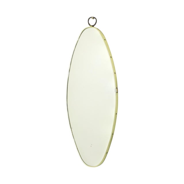 Nice mid-century modern or rockabilly freeform mirror from the 1950s, made from a wooden base with a gold-colored plastic...