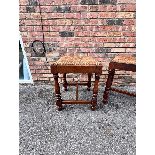 This is an excellent pair stools with the original rush seats. It has detailed turned legs and stretcher bar for...