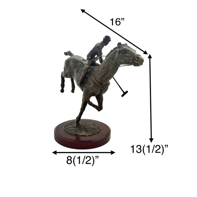 This vintage metal figurine depicts a skilled jockey riding a majestic horse, mounted on a sturdy wooden base. Crafted...