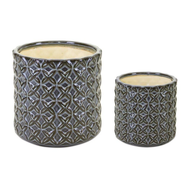 Showcase your greenery in style with this striking set of Geometric Pattern Ceramic Pots. With a bold, blue-and-white...