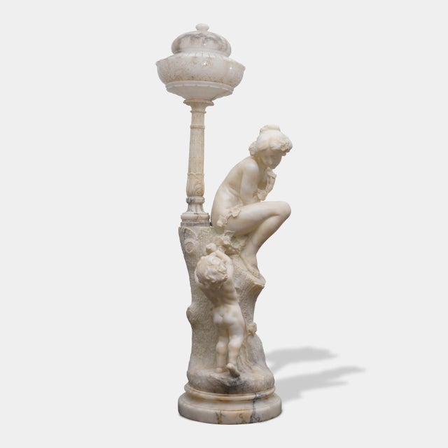 Pair of Monumental Antique Italian Carved Alabaster Venus & Cupid Figural Torchiere Lamps on Black Marble Pedestals For Sale - Image 4 of 12