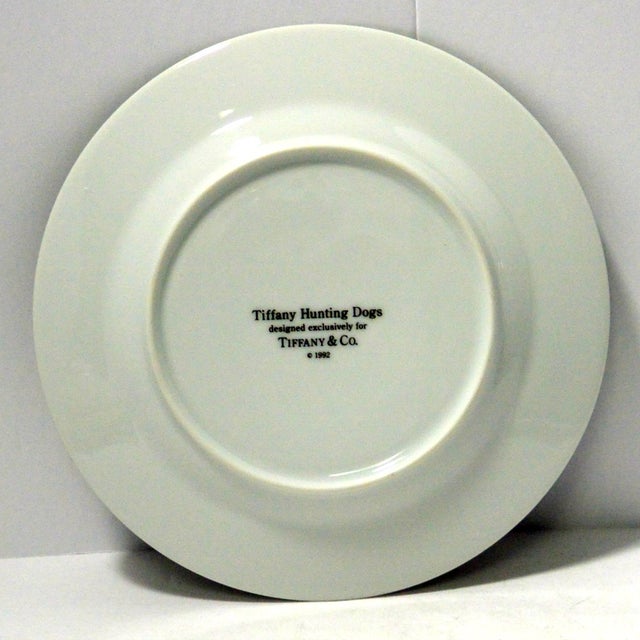 This decorative, porcelain plate was designed exclusively by Tiffany & Co. in 1992, as part of a set entitled "Hunting...