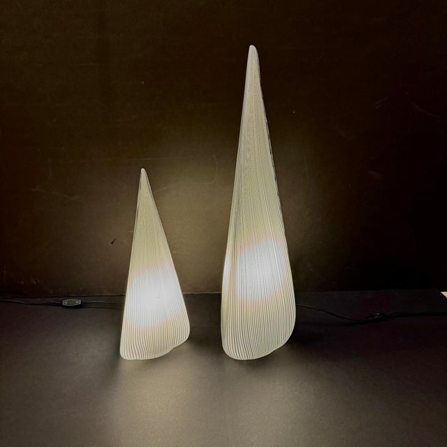 A pair of tear drop shaped Italian Art glass table lamps. One Edison base light socket inside each glass casing, with gray...
