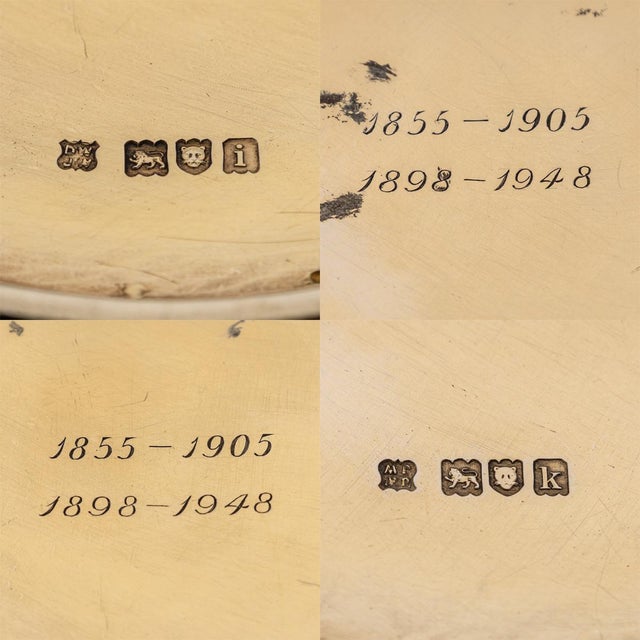 Antique early-20th century solid silver-gilt wine bottle coasters in the regency style, featuring a distinctive rope top...