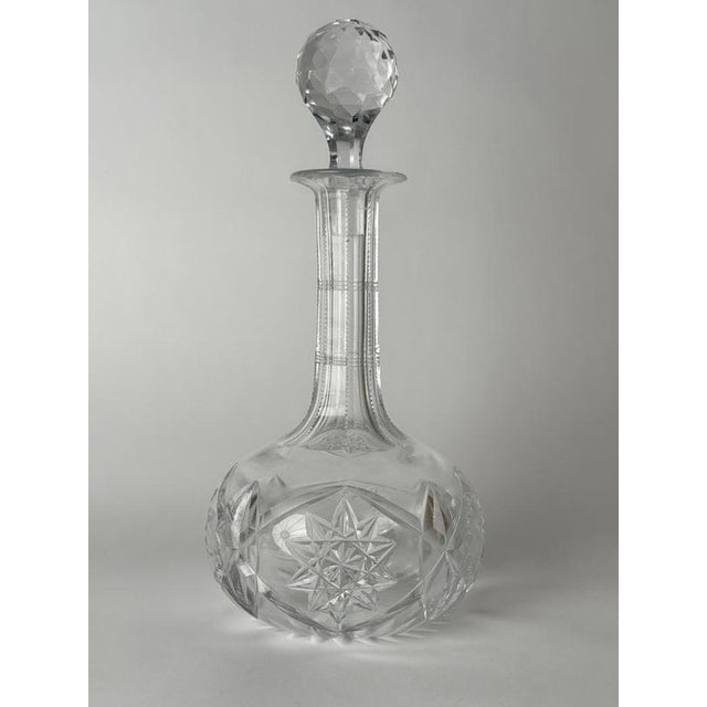 An exceptional antique hand-cut crystal whiskey decanter, most likely crafted in Bohemia or Central Europe around the turn...