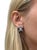 These beautiful earrings contain two radiant cut diamonds weighing 2.19 and 2.15 carats, surrounded by rectangular step...