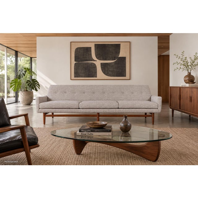 This exceptional mid-century modern walnut sofa showcases the clean lines and thoughtful craftsmanship that made American...