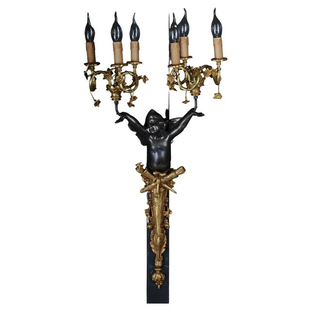 Pair of (2) Empire bronze putto sconces, gilt Impressive wall sconces, finely chiseled bronze and partly gilded. Richly...