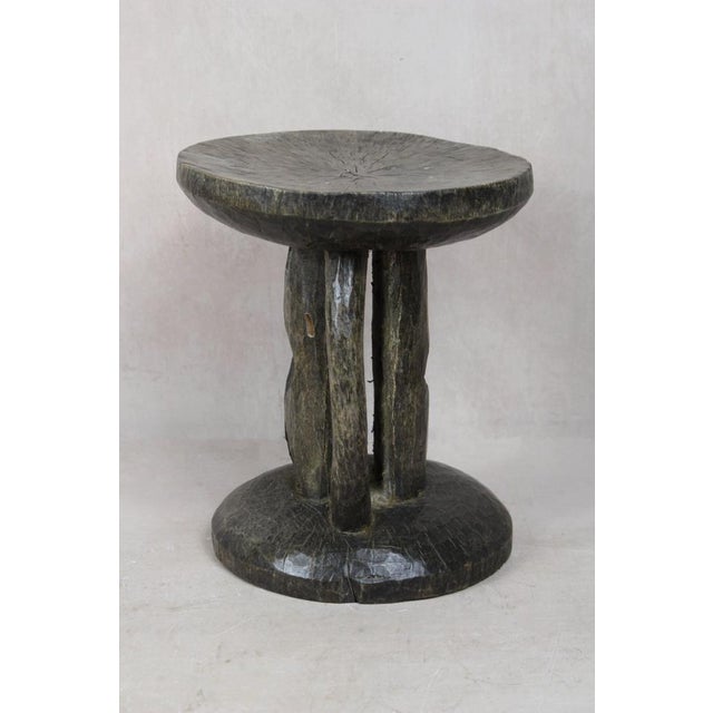 Hand-carved from a single piece of wood, the Tonga stool is a genuine artifact. These stools were status symbols for...