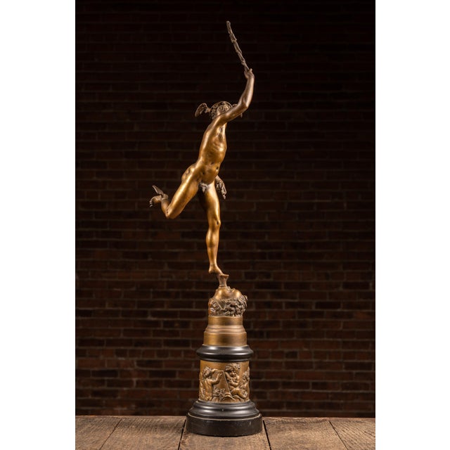 Bronze figural sculpture modeled after Giambologna's celebrated Renaissance depiction of Hermes, messenger of the gods....