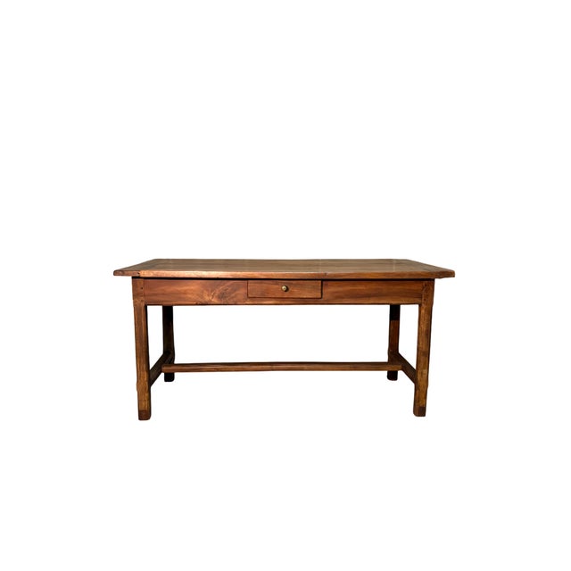 Nineteenth-century walnut table featuring a drawer inspired by the 18th-century Aosta Valley style. The solid structure...