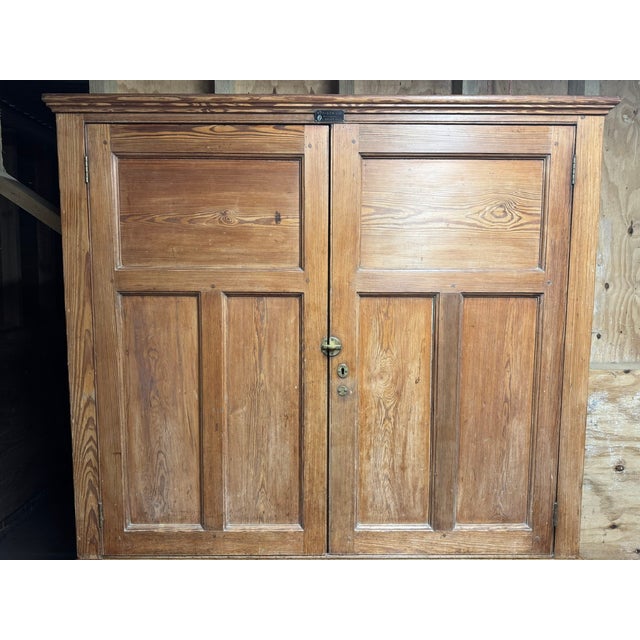 A lovely Pine Cabinet or Cupboard from a school, dating to the 19th Century and having loads of character and its original...