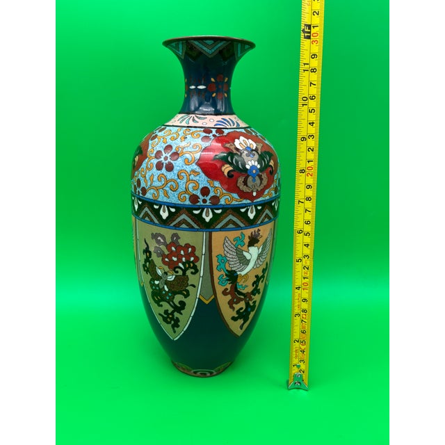 Beautiful large antique Japanese cloisonné enamel vase featuring elaborate shield-shaped panels decorated with a ho-o...