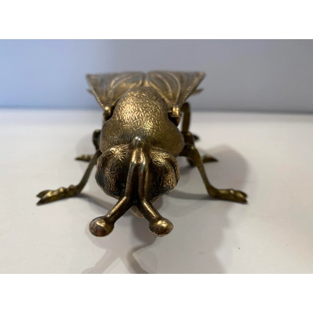 Vintage sculptural brass fly ashtray with hinged wings that flip open. Circa 1960s.