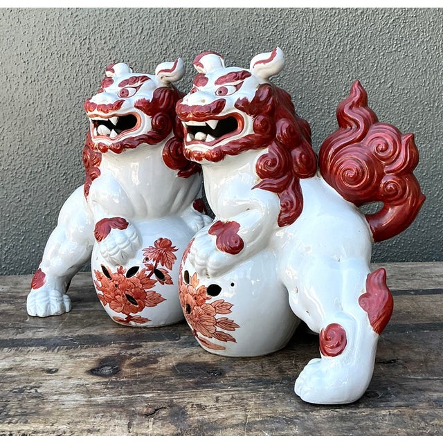 Enhance your interior with this striking pair of vintage ceramic Foo Dogs, traditional Chinese guardian lions that...