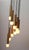 70s cascade lamp. Made in brass, matt brushed. Black cable. The lamp is 10-flame, for light bulbs with a large thread....