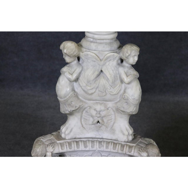 Make a dramatic statement with this exceptional pair of white figural marble pedestals, masterfully sculpted to bring...