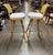 A pair of bentwood swivel barstools with upholstered seat and cane (plastic) backrest fabricated in 1995. The footrest is...