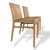 A stylish pair of bentwood plywood dining chairs, featuring a clean and sculptural modernist design. The chairs are formed...