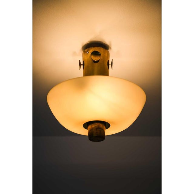 Metal Modern Scandinavian Ceiling Lamp in Brass and Opaline Glass by Paavo Tynell, 1950s For Sale - Image 7 of 11