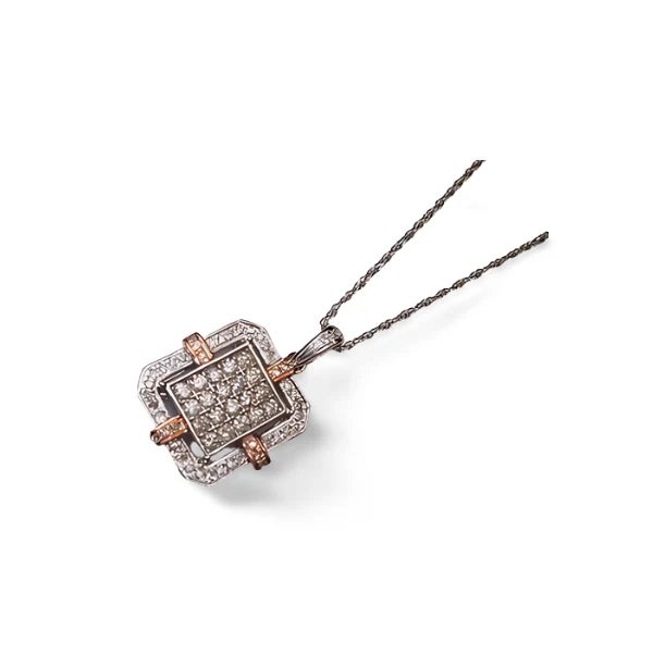 Add a touch of elegance to your jewelry collection with the 14K Pink and White Gold Diamond Pendant Necklace . This...