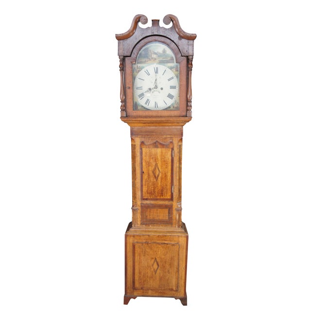 This antique English longcase clock is a beautifully preserved example of mid-19th-century provincial craftsmanship,...