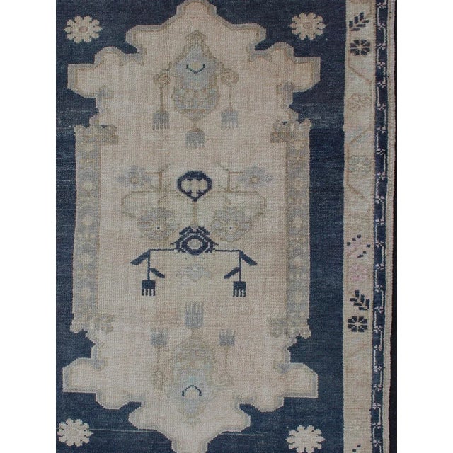 Tribal Geometric Medallion design Turkish vintage Oushak in blue and cream, Keivan Woven Arts / rug country of origin /...