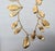 Vintage 1982 Signed Napier Goldtone Feather Charm Necklace For Sale - Image 11 of 14