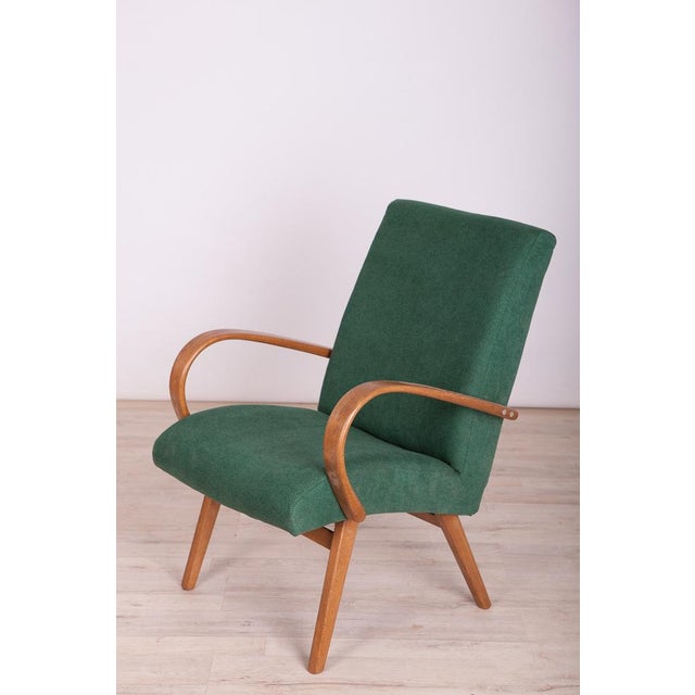 Armchair type 53 designed by Jaroslav Smidek, produced in the 1960s by the TON factory. The furniture has undergone...