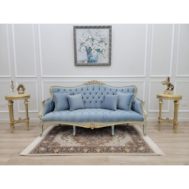 Bring a touch of old-world romance into your home with this breathtaking French Provincial sofa, designed to feel like it...