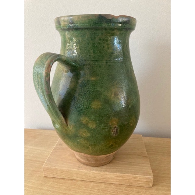 This is a lovely faience jug, great green color and patina