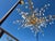Beautiful contemporary style gold leaf branch design with chunks of uncut rock crystals hanging from the branches. A few...