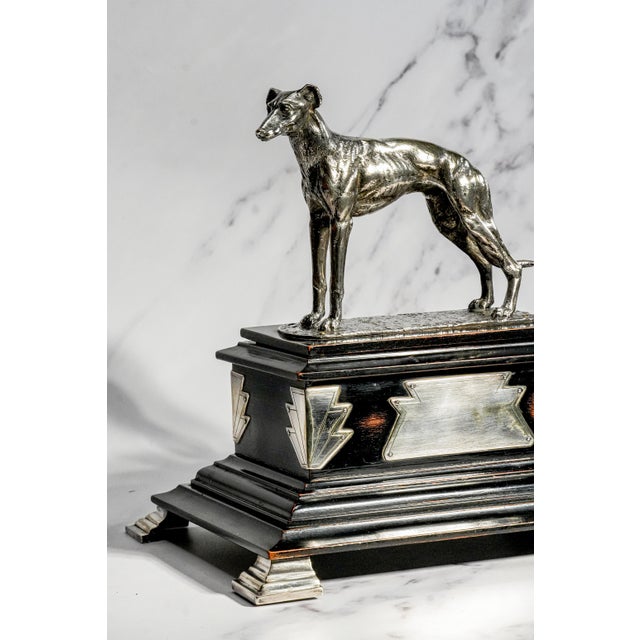 A striking and exceptionally rare form of 1920s English Art Deco design, this substantial antique box combines bold...