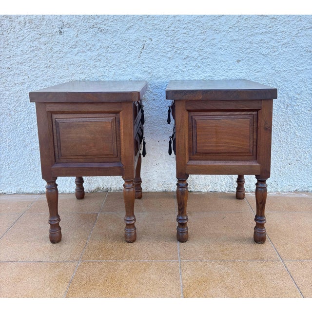 Charming pair of Spanish bedside tables crafted in solid wood, featuring a clean and balanced design inspired by...