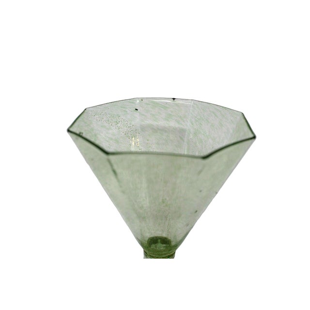 This very old Murano wine glass is in very good condition. There are slight ash deposits within the glass, which is...