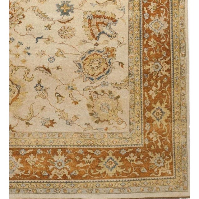 All over floral pattern on beige field. Wool pile on cotton foundation. Handmade. 9'9"x 8'