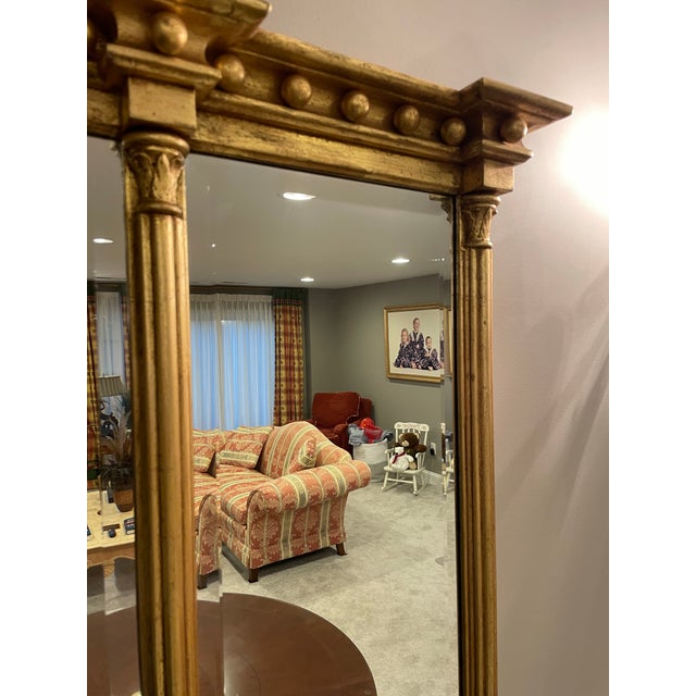 Large Friedman Brothers three panel mirror, (58”W x 39”H x 3&3/4”D). The three mirror panels are bevelled glass. The...