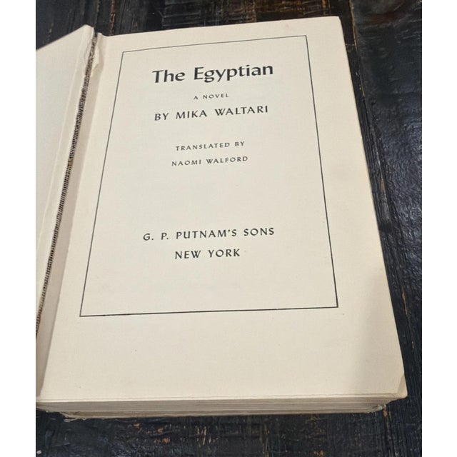 The product is a vintage hardcover first edition novel by Mika Waltari titled "The Egyptian," published in 1949. This...