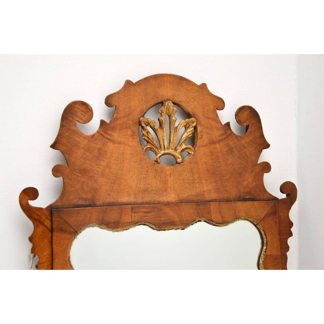 An absolutely stunning antique George II period walnut mirror. This was made in England, it has a carved date and location...