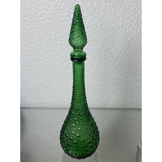 Empoli glass carafe, Italian production from the 1960s. Marking under the bottle: Made In Italy. The bottle is green in...