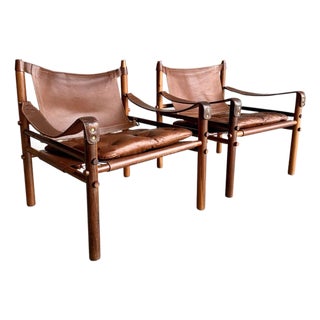 Mid Century Arne Norell Sirocco Rosewood and Brown Leather Safari Chair Pair For Sale