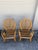 Striking pair of vintage bentwood rattan and wicker armchairs featuring tall, gracefully rounded woven backs and...