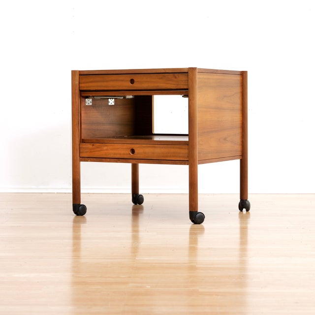 A wonderful example of Danish craftsmanship from the 1970s. This striking end table is a neat little storage piece, it is...