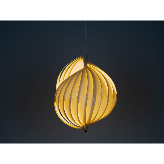 A Scandinavian modernist pendant lamp, designed in the 1960s by Flemming Brylle and Preben Jacobsen in Denmark. The lamp...