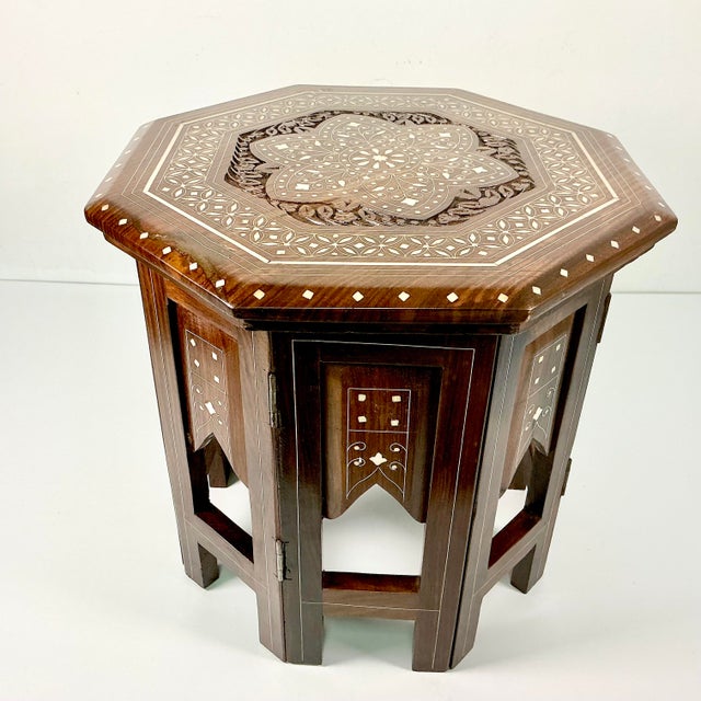 Vintage Home is pleased to offer this beautifully inlaid hand-carved wood Moroccan Octagonal Drinks Table. The carved wood...